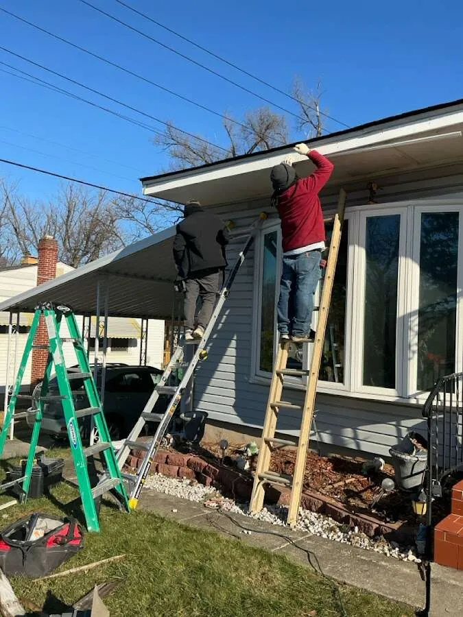 Restoration crew performing exterior repair in Newmarket